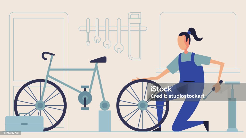 Professional woman holding cycle frame in bicycle